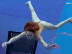 DustyPorn presents: Curly hair redhead swims and looks sexy